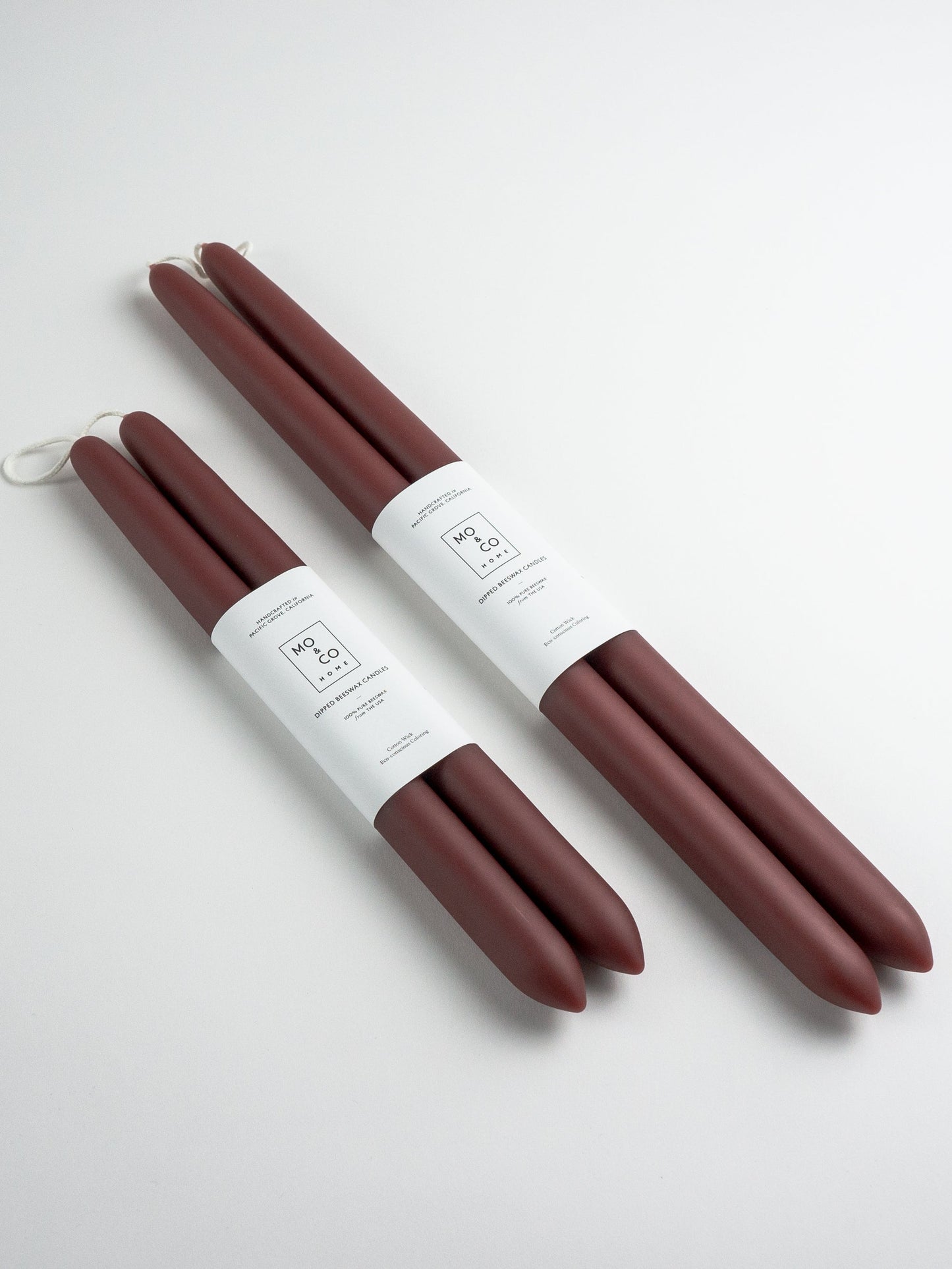 Set of burgundy fall candles with white labels