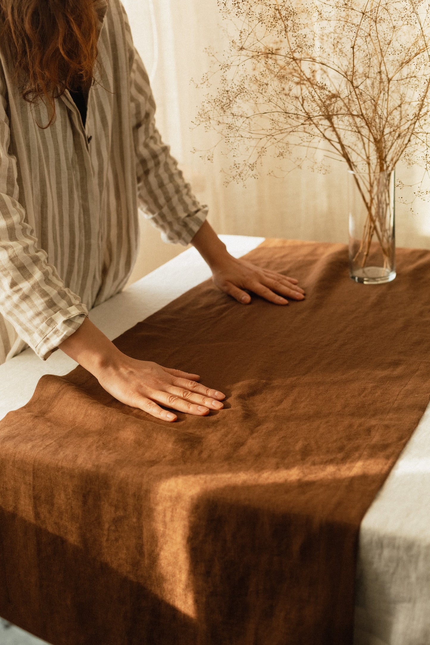 Rustic table setting with linen table runner in brown color