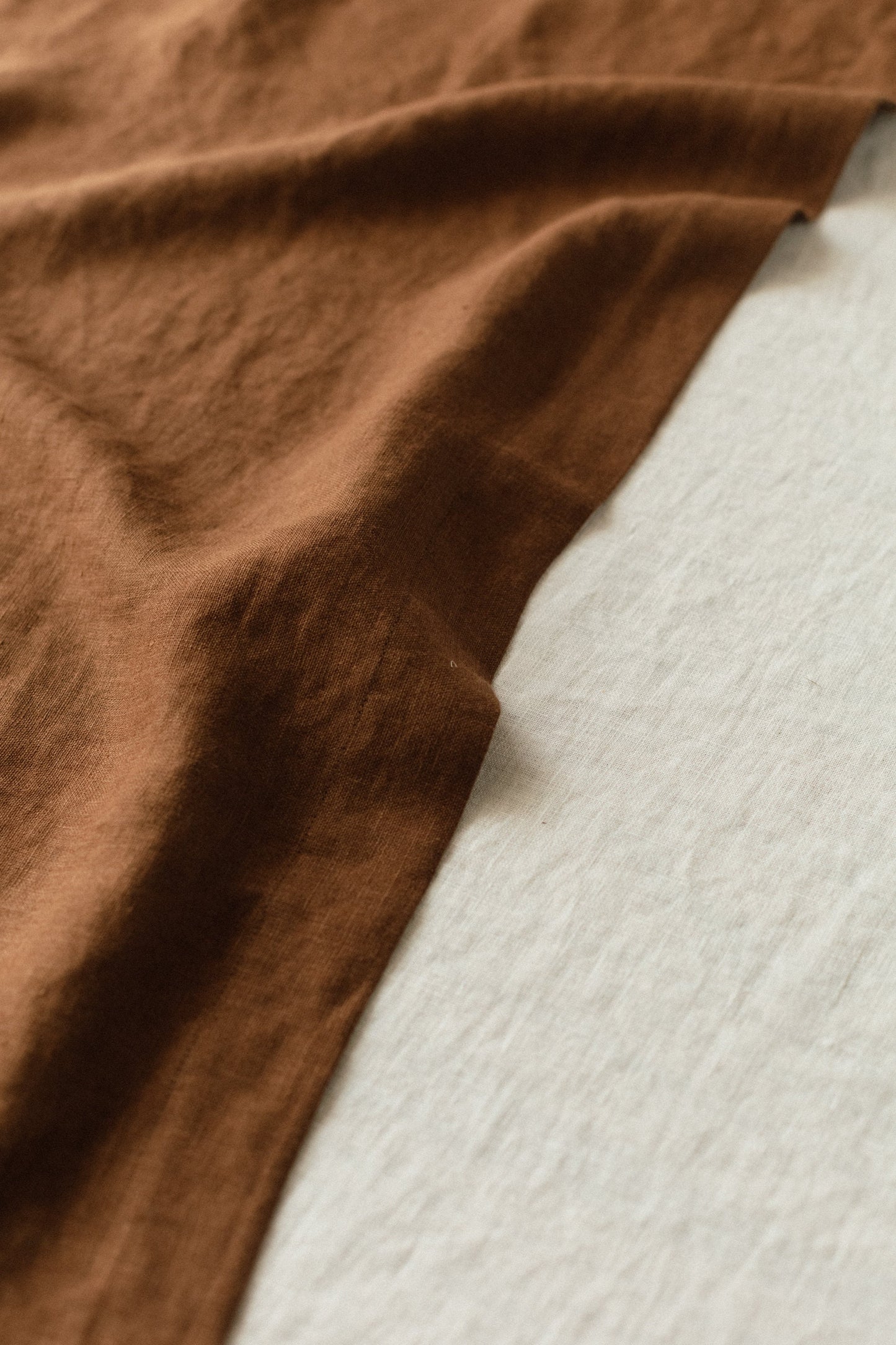 Linen table runner texture, chocolate color contrasting with milk color
