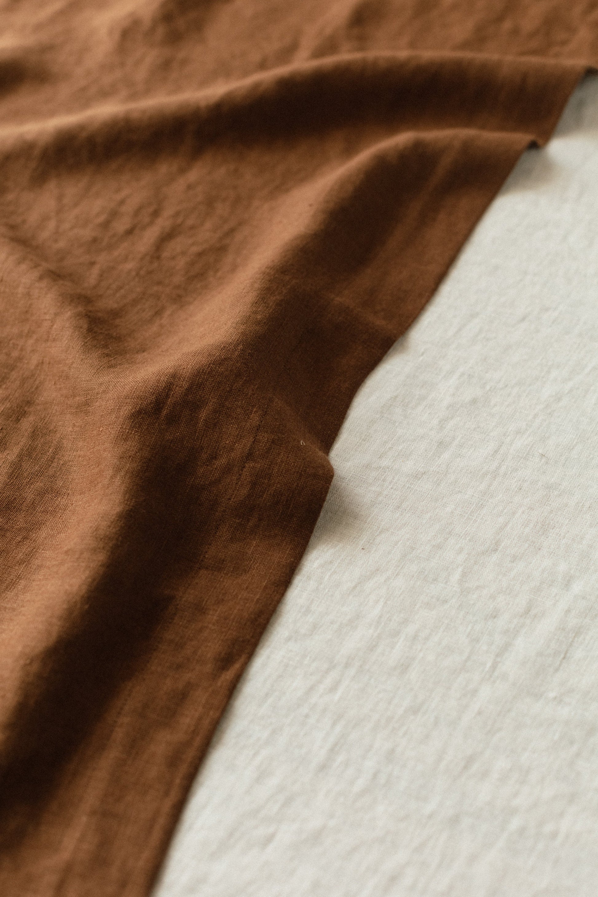 Linen table runner texture, chocolate color contrasting with milk color