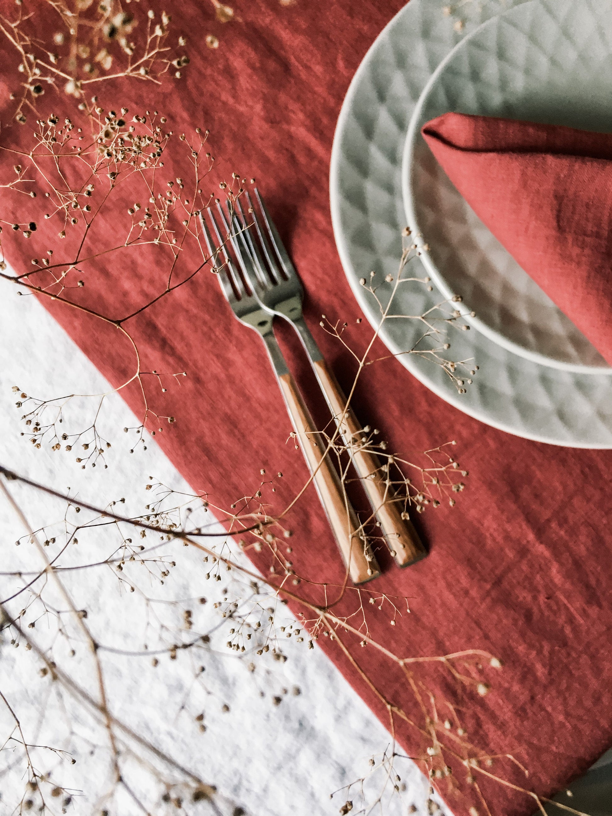 Elegant table setting with linen runner and napkins by Fine Dining 4 Home, wooden flatware, grey plates