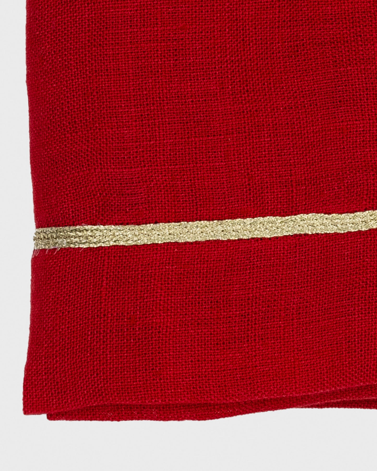 Red fabric with a gold stripe on a white background