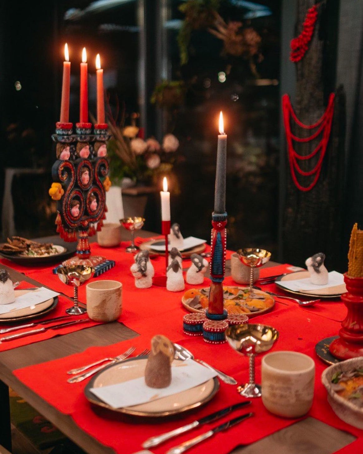 Decorative table setting with candles and red table linens by NEST home goods (Fine Dining 4 Home)